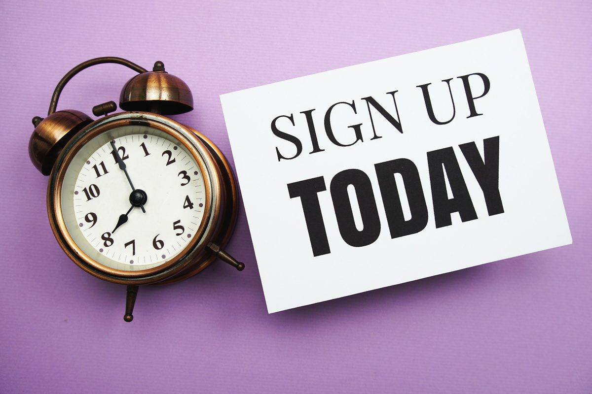 Sign up Today text and alarm clock on purple background